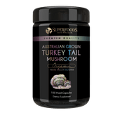 A miron violet glass jar labeled 'Australian Grown Turkey Tail Mushroom Capsules' by Superfoods Australia, indicating organic and premium quality. Organically grown in the Yarra valley Victoria Australia.