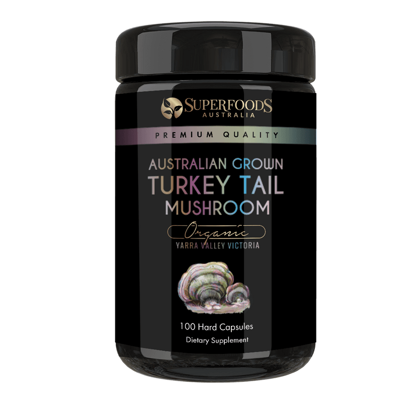 A miron violet glass jar labeled 'Australian Grown Turkey Tail Mushroom Capsules' by Superfoods Australia, indicating organic and premium quality. Organically grown in the Yarra valley Victoria Australia.
