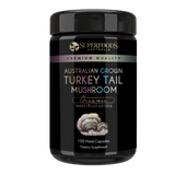 A miron violet glass jar labeled 'Australian Grown Turkey Tail Mushroom Capsules' by Superfoods Australia, indicating organic and premium quality. Organically grown in the Yarra valley Victoria Australia.